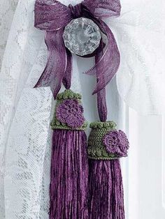 two purple tassels are hanging on the door