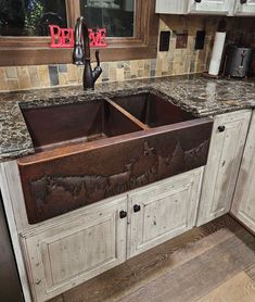 an old kitchen sink with rusted metal faucets