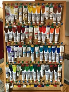 a display case filled with lots of different types of paint