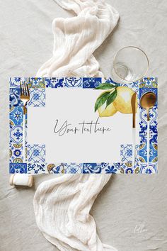 a place setting with blue and white tile