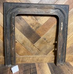 an old frame sitting on top of a wooden floor