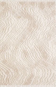 a white rug with wavy lines on it