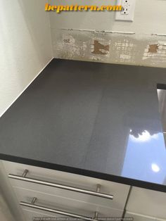 a kitchen counter top that has been painted black