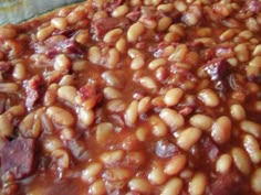 baked beans with bacon in a pan ready to be cooked