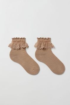 Soft ribbed knit crew socks trimmed with a ruffle accent. Content + Care 76% Cotton, 22% polyester, 2% spandex Machine wash Imported Size + Fit Crew length | Ruffle Ribbed Crew Sock in Taupe, Women's at Urban Outfitters Winter Ruffle Socks, Socks And Clogs, Fall Socks, Ruffle Socks, Ruffled Socks, Crew Sock, Winter Fits, Ruffle Trim, Knitting Socks