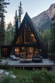 a - frame cabin in the woods with an open floor plan