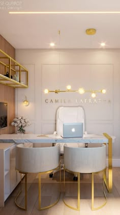 the interior of a modern office with white and gold furniture