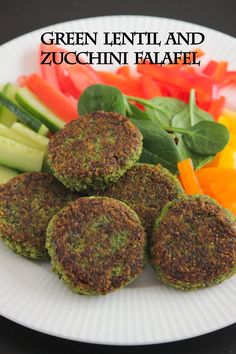 green lentil and zucchini falafel on a plate with vegetables