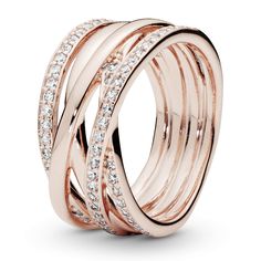 PRICES MAY VARY. Rose gold metal ring The ring is plated with 14ct rose gold Ring consists of tangled rails The rails are partially covered with sparkling zirconias Wide ring rail 10 mm Pandora Rose, Aquamarine Engagement Ring, Pandora Rings, Diamond Pendant Necklace, Pandora Jewelry, Dandy, Gold Gold, Modern Jewelry, Womens Jewelry Rings