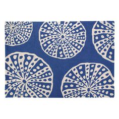 a blue and white rug with circles on it