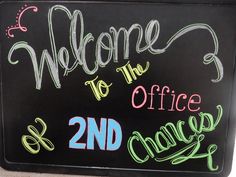 a chalkboard sign that says welcome to the office and 2nd class