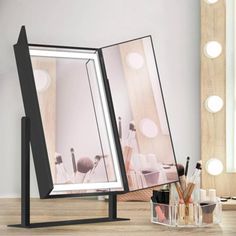 an image of a makeup mirror with lights in the background