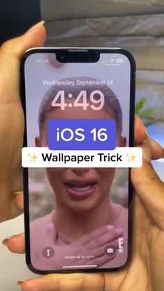 someone is holding up their iphone to show the wallpaper trick