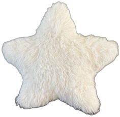 a white sheepskin star shaped rug on a white background with clipping for text