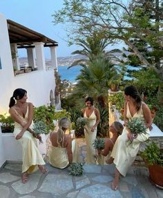 the bridesmaids are getting ready to walk down the aisle