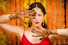 a woman with henna on her hands