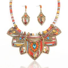 PRICES MAY VARY. Gold Jewelry Sets for Women:Zhlichouy gold plated ethnic style jewelry sets for women with fashion exquisite design,Integrating elements of Bohemia and India,it has strong color combination feeling High quality Material:the dainty trendy charm choker nekclace Made from high-quality materials.not easy to fade and deform nickel-free and lead-free,Hypoallergenic,Suitable for most women wear,no harm to your skin Gift for Charm Women:costume jewelry for women,can be any occasions,suc African Jewelry Necklaces, Feeling High, Women Costume, Bib Collar, Gold Jewelry Sets, Indian Jewelry Sets, Statement Choker, Statement Choker Necklace, African Jewelry