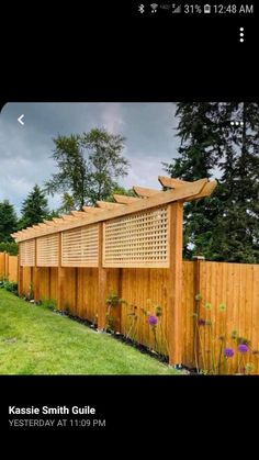 an image of a wooden fence in the yard