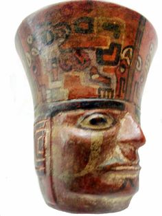 an ancient mask is shown against a white background