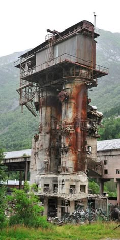 an old factory building in the middle of nowhere