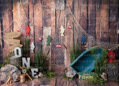 there are some decorations on the shelf in front of this wooden wall that says one