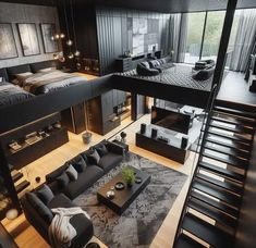 a living room filled with black furniture and lots of windows next to a stair case