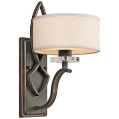 a wall light with a white shade on it