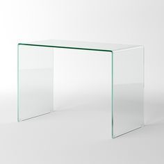 an empty glass table with no one sitting at the base or standing up on it