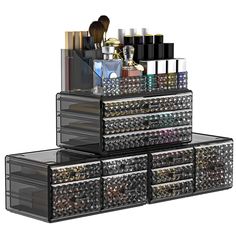 three drawers are stacked on top of each other with cosmetics and makeup products in them