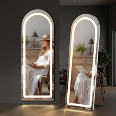 a woman sitting on a chair in front of a large mirror with light coming from it