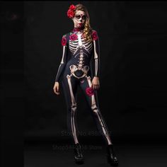 a woman in skeleton costume with red roses on her head and hands behind her back