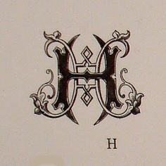 the letter h is made up of ornate designs and letters that appear to be capitalized