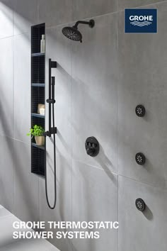 a shower with the words grohe thermostaic shower systems above it