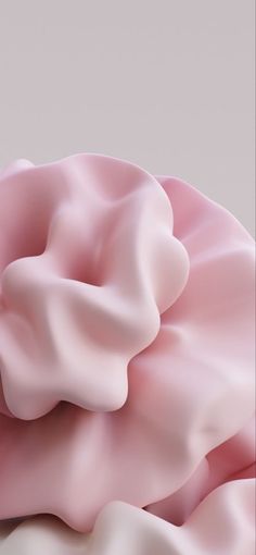 a close up of a pink object on a white surface