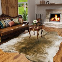 a living room filled with furniture and a fire place next to a couch on top of a hard wood floor