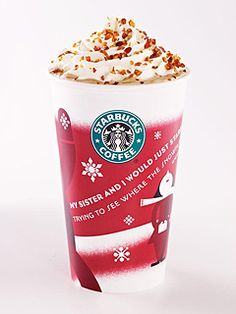 a starbucks cup with whipped cream and toppings