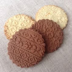 three cookies are sitting next to each other