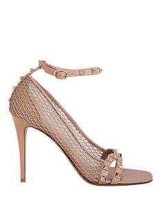 Valentino's inimitable Rockstuds never disappoint and these sandals come with a hint of vintage allure thanks to the fishnet-like mesh uppers. They have supple leather straps and rest on sleek 100mm stiletto heels.   Composition: leather.  Ankle-buckle closures.   Heel height: 3.9" .   Made in Italy.      Item is listed in Italian sizing, please make note of accurate size conversions. Luxury Mesh Heels, Luxury Mesh Heels For Formal Occasions, Luxury Mesh Heels For Party, Luxury Party Heels In Mesh, Luxury Party Mesh Heels, Summer Mesh Heels With Heel Strap, Fishnet High Heel Party Shoes, Fishnet High Heels For Party, Fishnet Party Heels