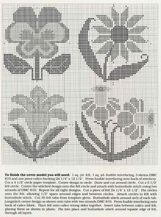 an old cross stitch pattern with flowers in the middle and one flower on the bottom