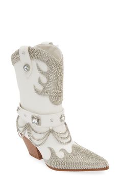 Head west in glamorous style in this rhinestone-bedecked cowboy boot finished with swinging metal chains and a steady block heel. 2 1/2" heel (size 8.5) 8 1/2" shaft Pull-on style Water-resistant Arch support Synthetic upper, lining and sole Imported Asian & Pacific Islander Owned/Founded Betsey Johnson Boots, Cowgirl Boots Wedding, Cowboy Shoes, Cowgirl Accessories, Bota Country, Azalea Wang, Perfume Gift Sets, Womens Fashion Inspiration, Glamorous Style