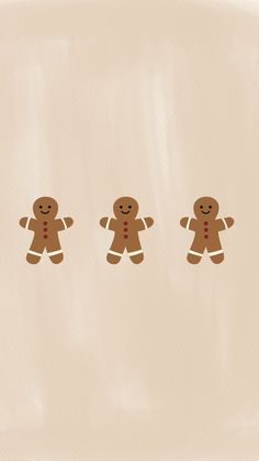 three gingerbread men standing next to each other