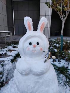 a snowman made to look like a bunny