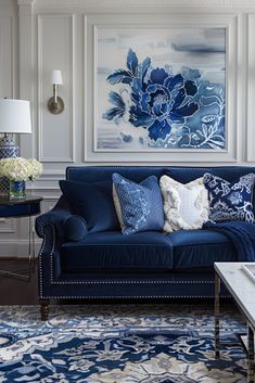 a living room with blue and white decor