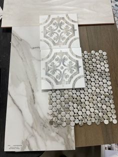 marble and tile samples are laid out on top of each other, with different patterns