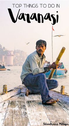 a man sitting on top of a wooden boat