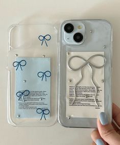 a person holding an iphone case with scissors on it and a tag attached to the back