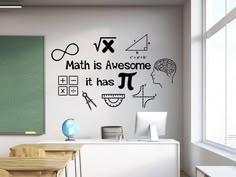 a classroom with black and white wall decals that say math is awesome it has pi