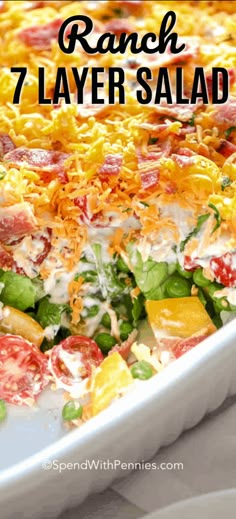 a white casserole dish filled with salad and cheese