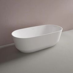 a white bath tub sitting on top of a counter