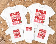 three shirts with the words dad and two daughters on them, sitting on a rug